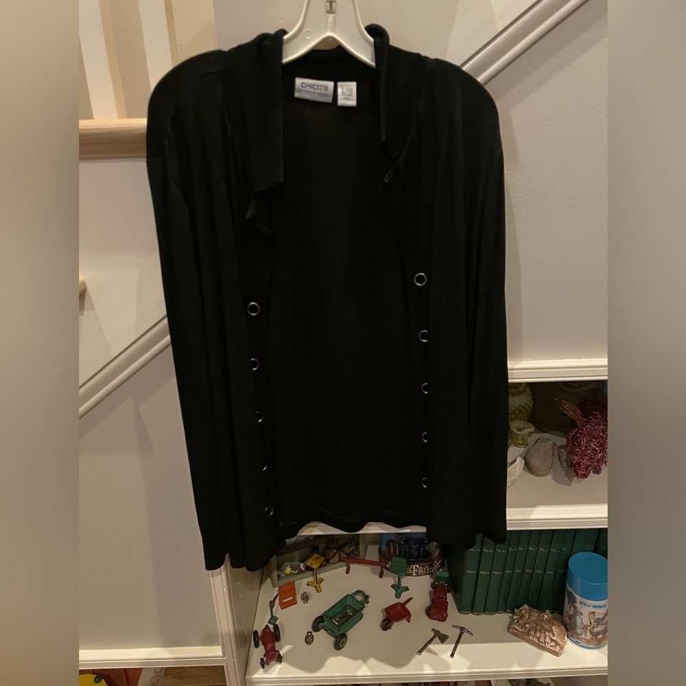 Black Chico’s long sleeve open jacket with grommet detail.  Size 3